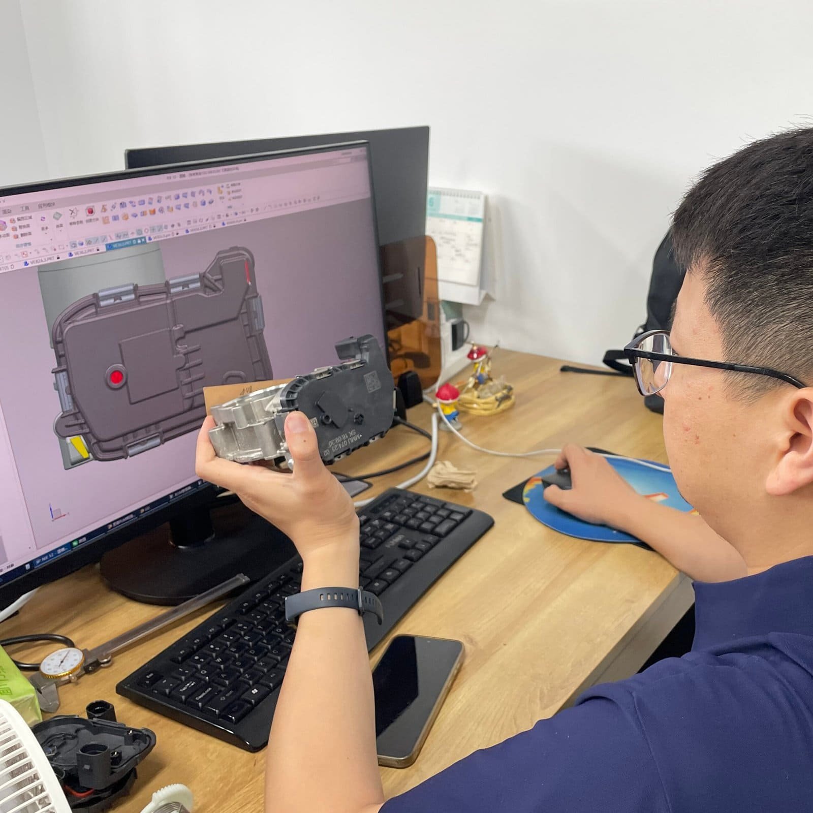 Engineer reviewing component drawings