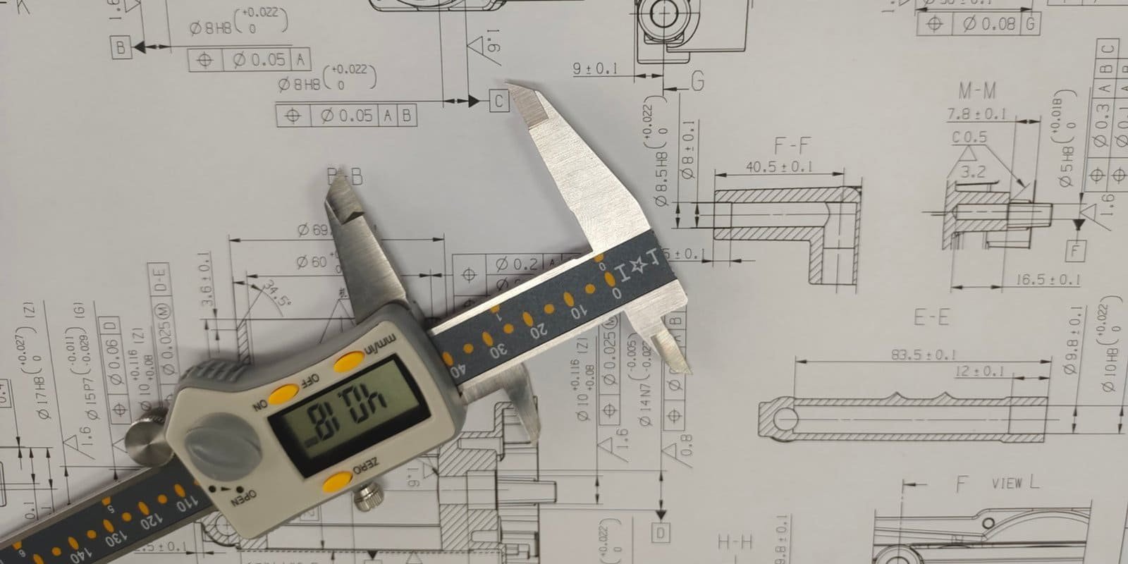 CAD workstation with 3D component model on screen